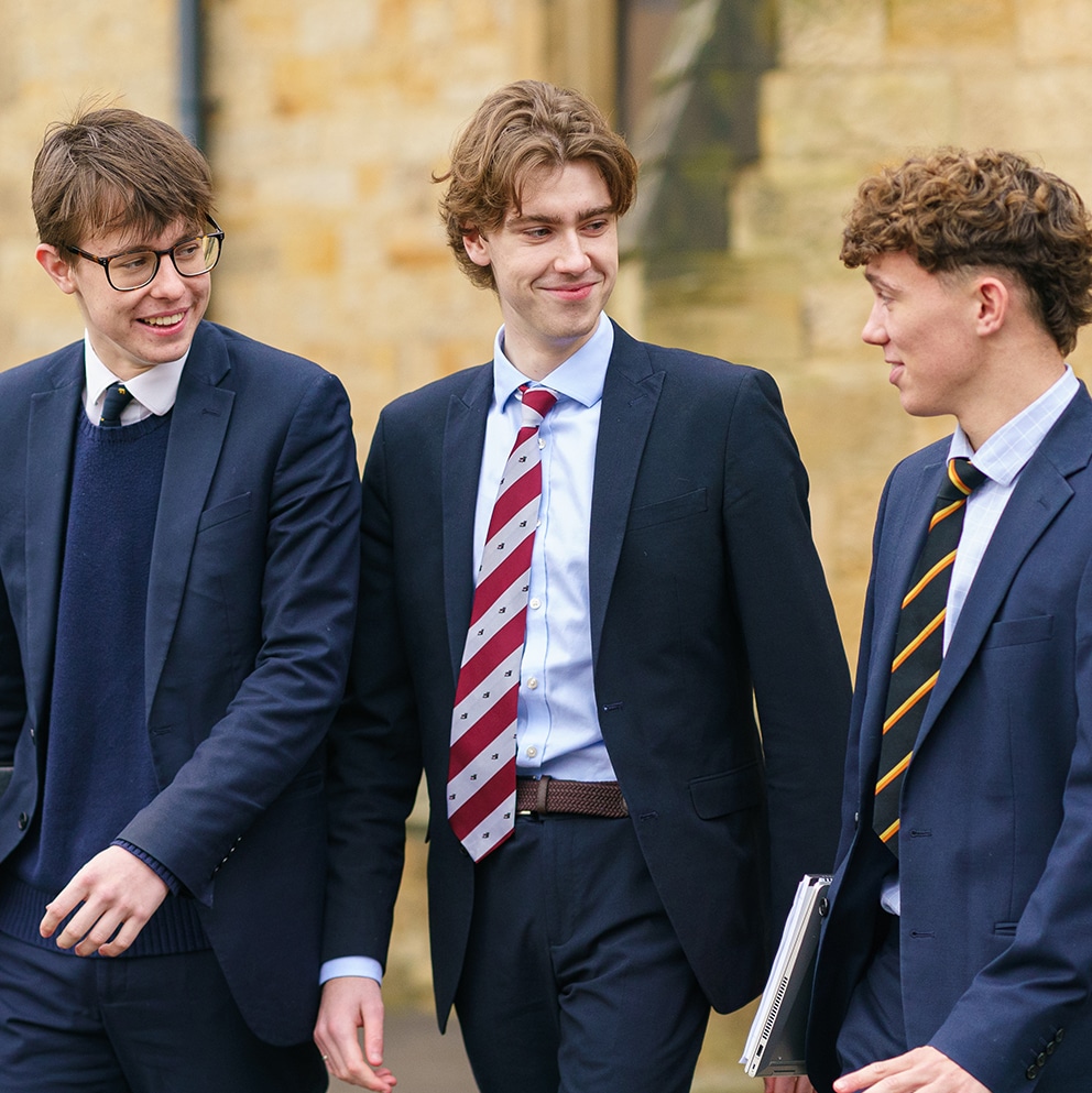 Boys walking outside front of School