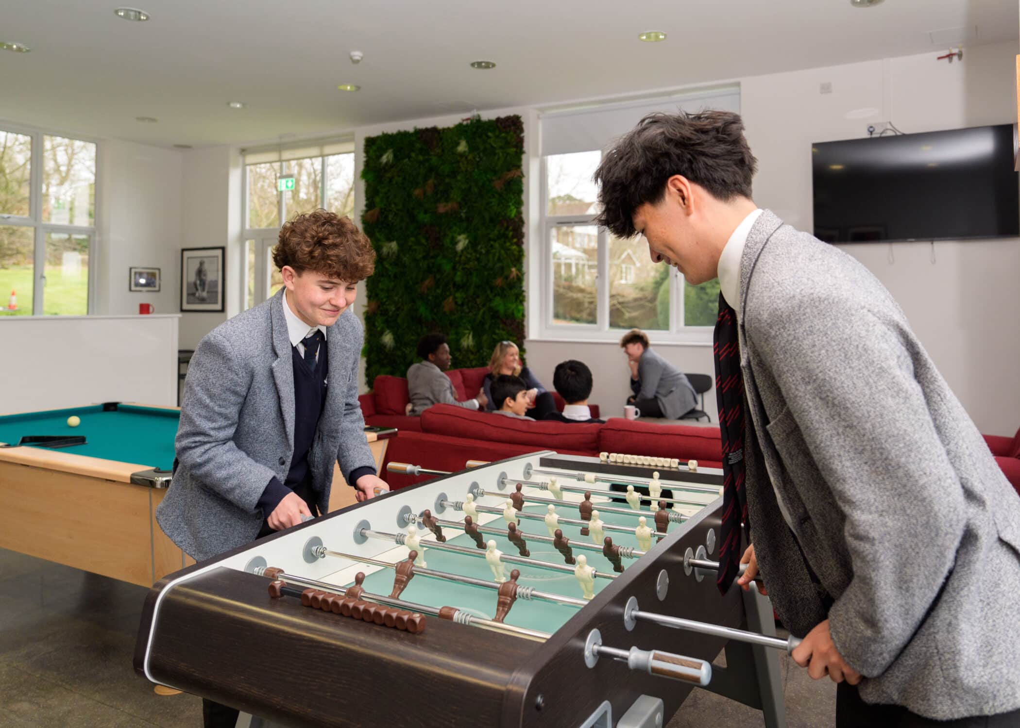 Boys playing fooseball