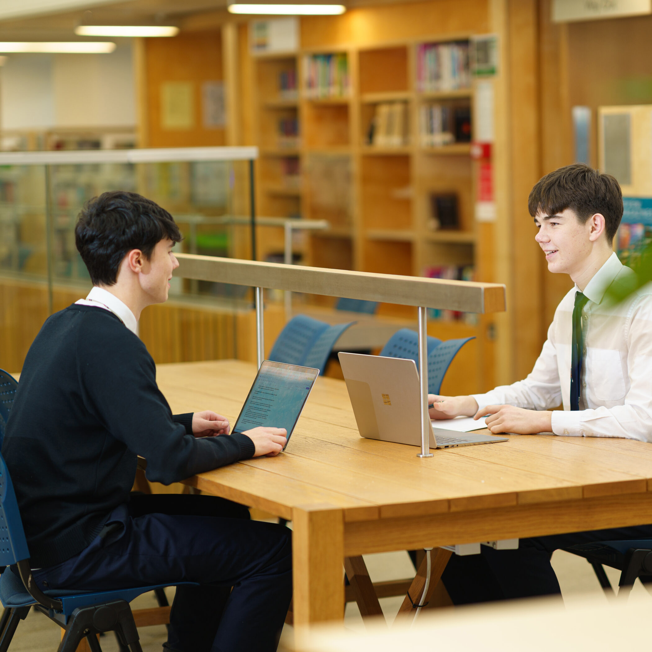Boys writing their EPQ in the Smythe Library.
